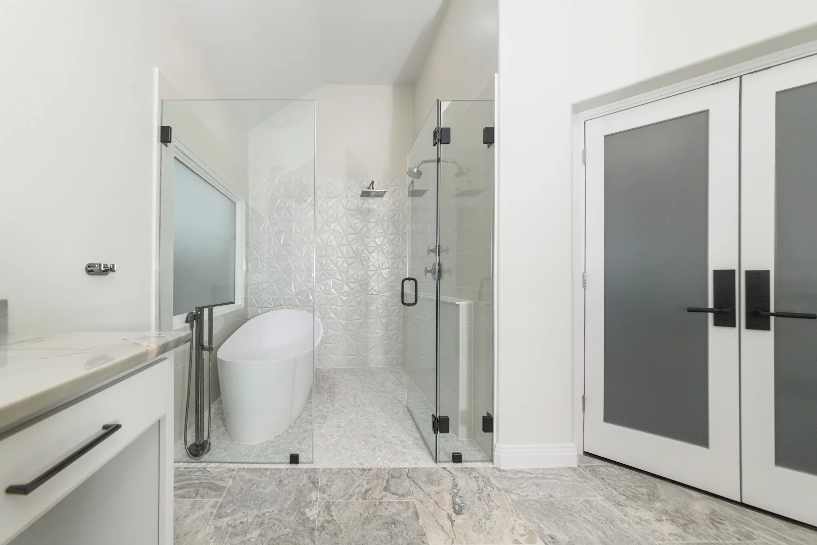 Walk-in shower with clear glass and bright tile